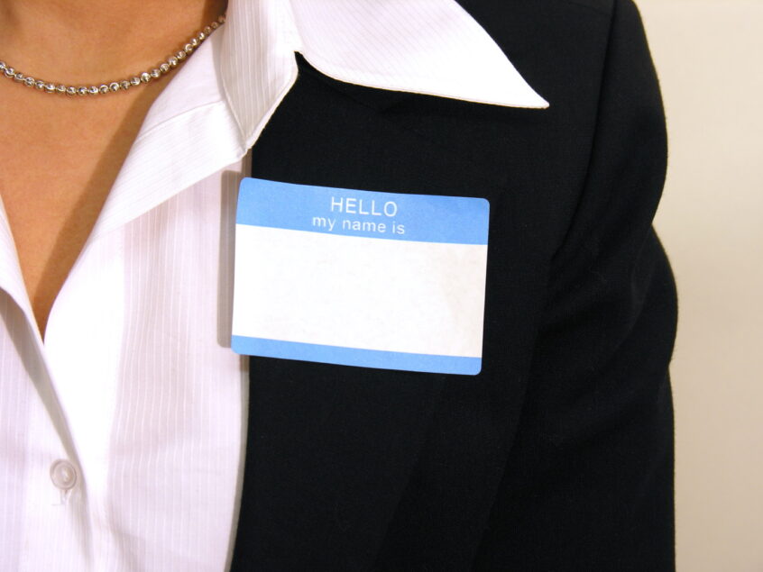 close up of woman with name tag